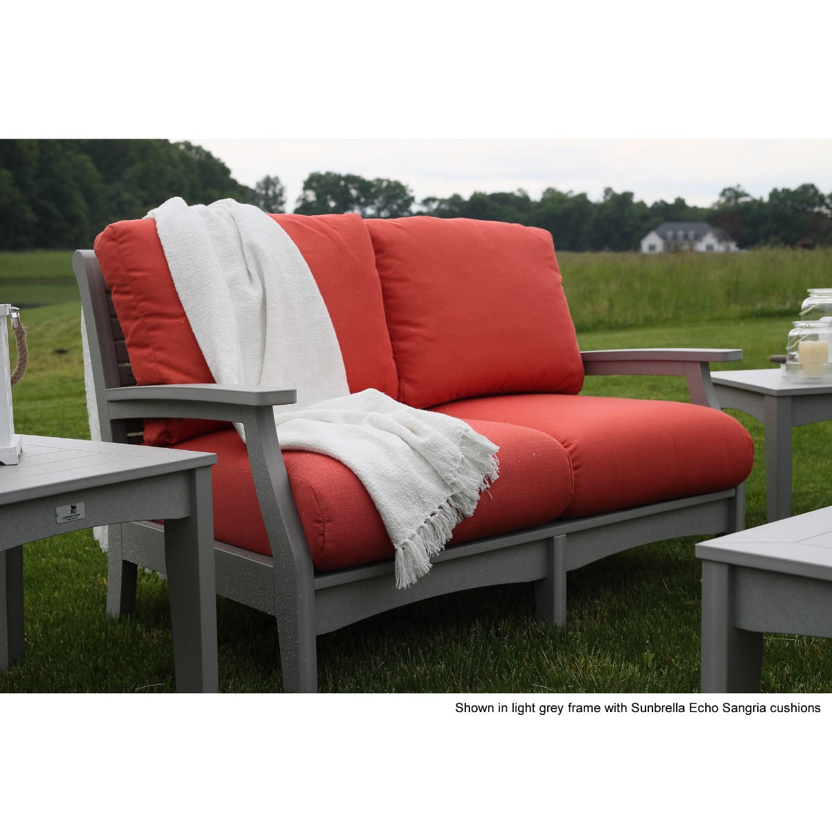 Shown in light grey with echo sangria cushions