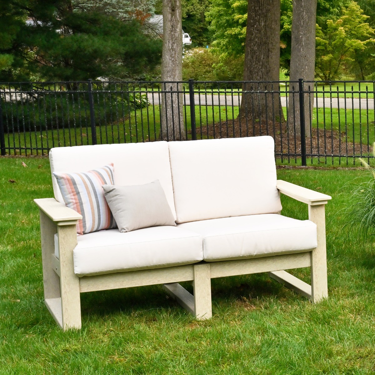 Shown in birch with canvas cushion.